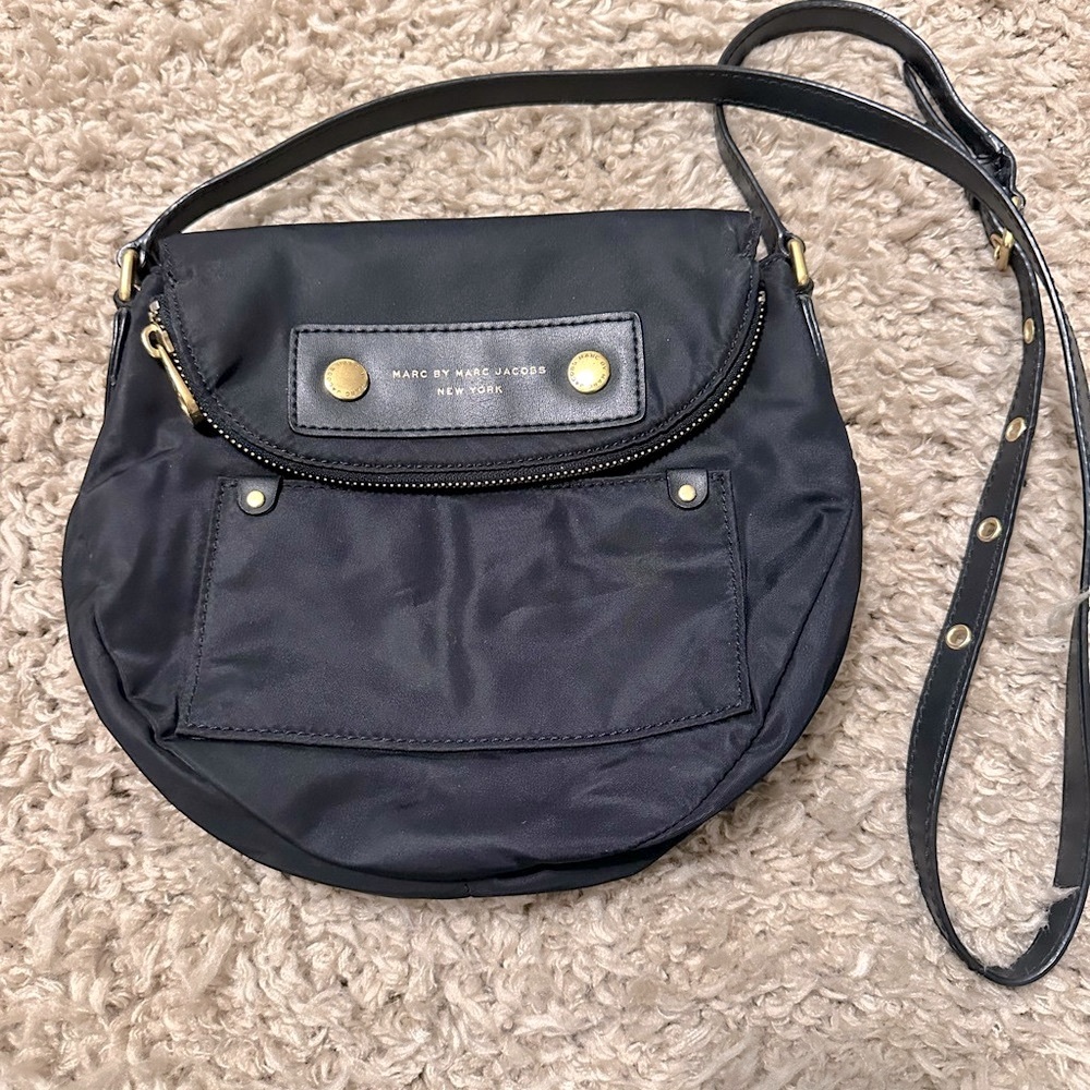 Black Marc Jacob’s nylon cross body with gold hardware.